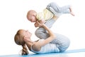 Young mother does fitness exercises together with baby boy isolated Royalty Free Stock Photo