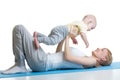 Young mother does fitness exercises together with baby boy isolated Royalty Free Stock Photo