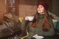 Young mother drinks coffee outdoor