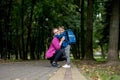 Young mother embraces her excited first class son on the way to school. Ready to study Royalty Free Stock Photo