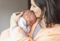 Woman holding a newborn baby in her arms