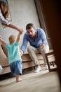 Mother and father at home learns to walk their child boy the fir Royalty Free Stock Photo