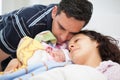 Young mother and father with their newborn baby girl at the hospital on the day of her birth. Family concept. Parenthood concept Royalty Free Stock Photo