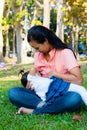 Young mother feeding her baby in the park Royalty Free Stock Photo
