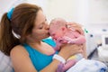 Young mother giving birth to a baby Royalty Free Stock Photo