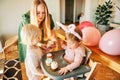 Young mother giving cupcakes to children Royalty Free Stock Photo