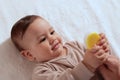 Young mother hand holding comb and brushing her baby. Close up Mother care. Concept of parenthood Royalty Free Stock Photo