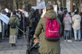 Young mother, her baby child and activists with placard and banners protest against animal abuse Royalty Free Stock Photo