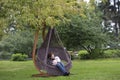 Young mother and her baby daughter in hammock Royalty Free Stock Photo