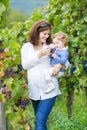 Young mother and her baby daughter in vine yard Royalty Free Stock Photo