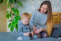 Happy young mother and her baby son playing togerher Royalty Free Stock Photo