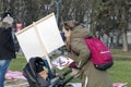 Young mother with her child in baby buggy and NO FUR sign placard at the march for Animal Advocacy in Riga, Latvia, Europe