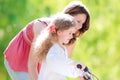 Young mother and her daughter on bicycle Royalty Free Stock Photo