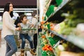 Young mother with her little baby boy at the supermarket. Healthy eating concept Royalty Free Stock Photo