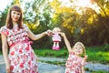 Mom and daughter are walking in the park Royalty Free Stock Photo