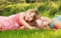 Young mother and her little daughter playing on grass Royalty Free Stock Photo