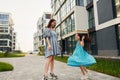 Young mother with her little daughter walking near the buildings Royalty Free Stock Photo