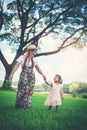 Young mother and her little daughter walking Royalty Free Stock Photo