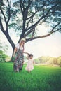 Young mother and her little daughter walking Royalty Free Stock Photo