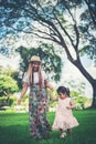 Young mother and her little daughter walking Royalty Free Stock Photo