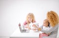 Young mother, her little and pets children having grate time together Royalty Free Stock Photo