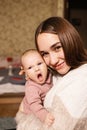 Young mother with her newborn baby at home. Happy family concept. Royalty Free Stock Photo