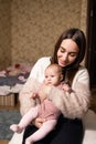 Young mother with her newborn baby at home. Happy family concept. Royalty Free Stock Photo