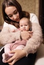 Young mother with her newborn baby at home. Happy family concept. Royalty Free Stock Photo