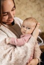 Young mother with her newborn baby at home. Happy family concept. Royalty Free Stock Photo