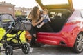 mother with her son behind the car preparing the trip Royalty Free Stock Photo