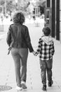Young mother and her son walking at city. Family, lifestyle and relationship Royalty Free Stock Photo