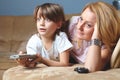 Young mother with her son watch tv