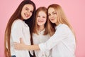 Young mother with her two daughters is in the studio Royalty Free Stock Photo