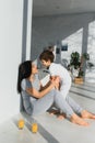 Young mother with her 4 years old little son dressed in pajamas are relaxing and playing in the bedroom at the weekend together, Royalty Free Stock Photo