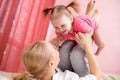 Young mother holding baby, fun, exercise, leisure Royalty Free Stock Photo