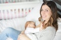 Young mother holding her baby child. Mom nursing baby. Royalty Free Stock Photo