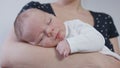 Young Mother Holding Her Baby in Her Arms Royalty Free Stock Photo