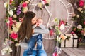 Young mother holding her newborn child. Woman and baby boy relax in a white bedroom. Nursery interior. Family at home Royalty Free Stock Photo