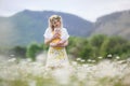 A happy young mother gently holds her newborn son in her arms Royalty Free Stock Photo