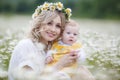 A happy young mother gently holds her newborn son in her arms Royalty Free Stock Photo