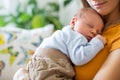 Young mother, holding tenderly her newborn baby boy Royalty Free Stock Photo