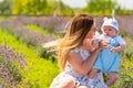 Young mother holding up her little baby son Royalty Free Stock Photo