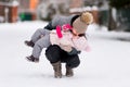 A young mother holds a little daughter in her arms and kisses her Royalty Free Stock Photo