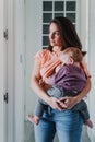 young mother at home breast feeding her adorable one year old baby girl. family time Royalty Free Stock Photo