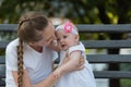 Young mother hugging cute baby girl. Joys of motherhood Royalty Free Stock Photo