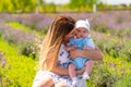 Young mother hugging her baby son outdoors Royalty Free Stock Photo