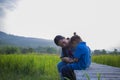 Young mother hugging and soothing a crying little long hair  boy, Asian mother trying to comfort and calm down her crying child Royalty Free Stock Photo