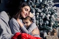 Young mother hugs daughter in pajamas holding her in her arms Royalty Free Stock Photo