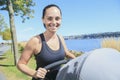 Young mother jogging with a baby buggy Royalty Free Stock Photo