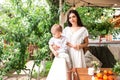 Young mother with kid in gazebo Royalty Free Stock Photo